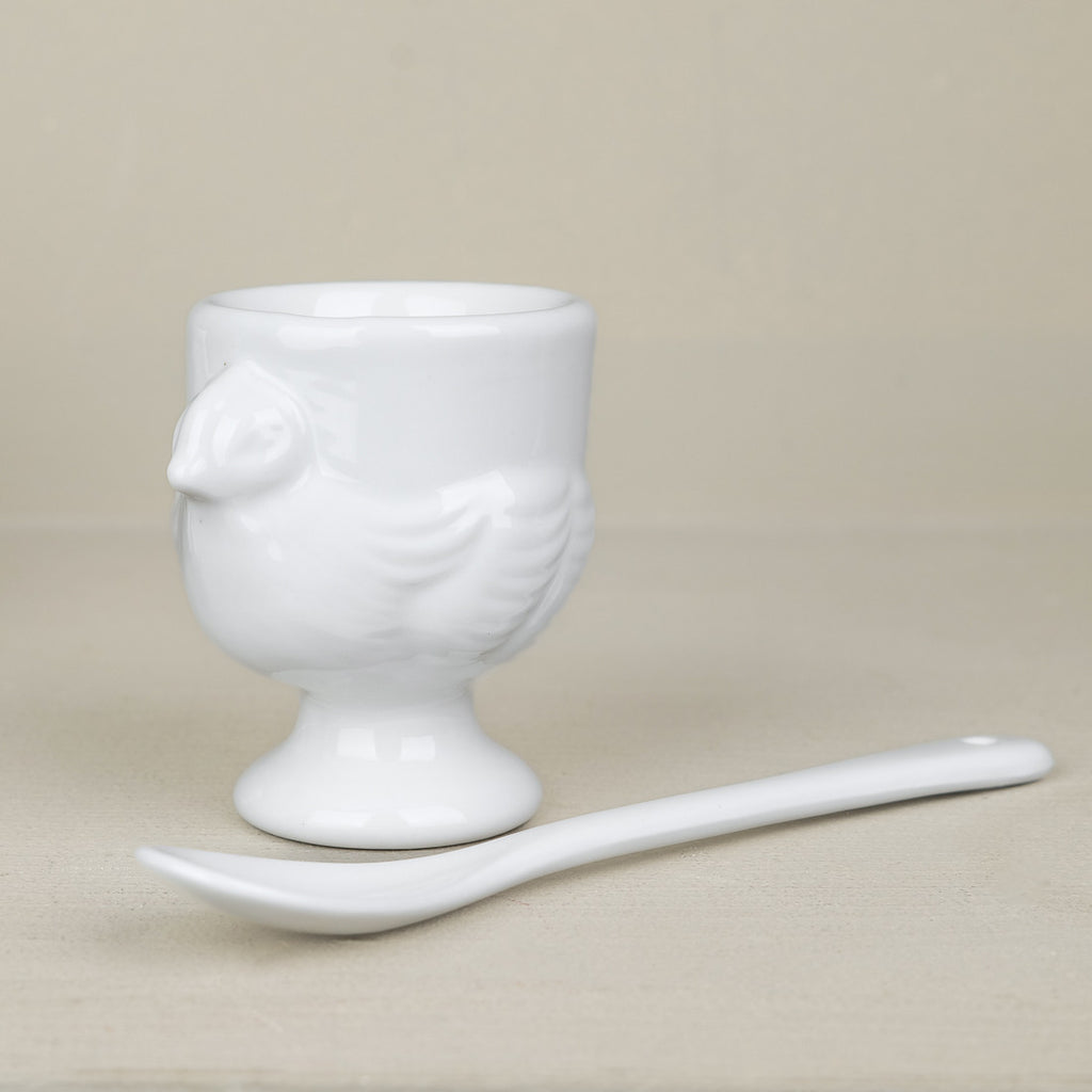 Set of 4 porcelain egg cups and teaspoons
