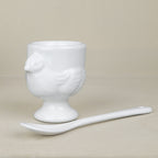 Set of 4 porcelain egg cups and teaspoons