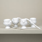 Set of 4 porcelain egg cups and teaspoons