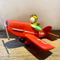 Tirelire le Petit Prince dans son avion