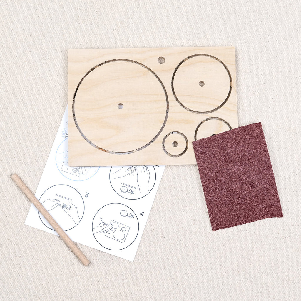 Wooden spinning top to assemble