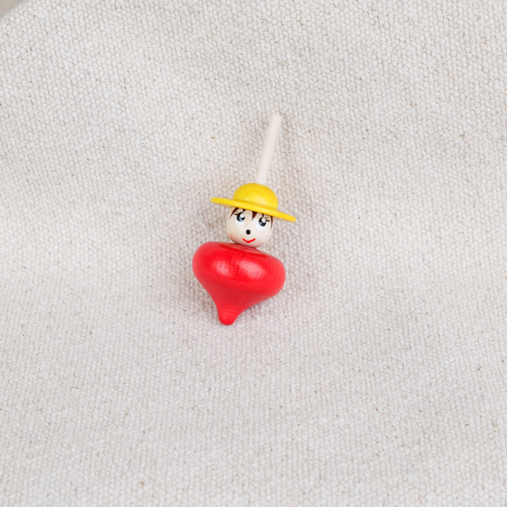 Wooden character spinning top