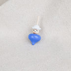 Small blue wooden spinning top