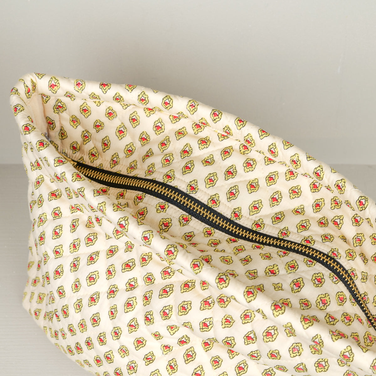 Quilted cotton wash bag by Segue Segue, zip closure and Provençal print lining