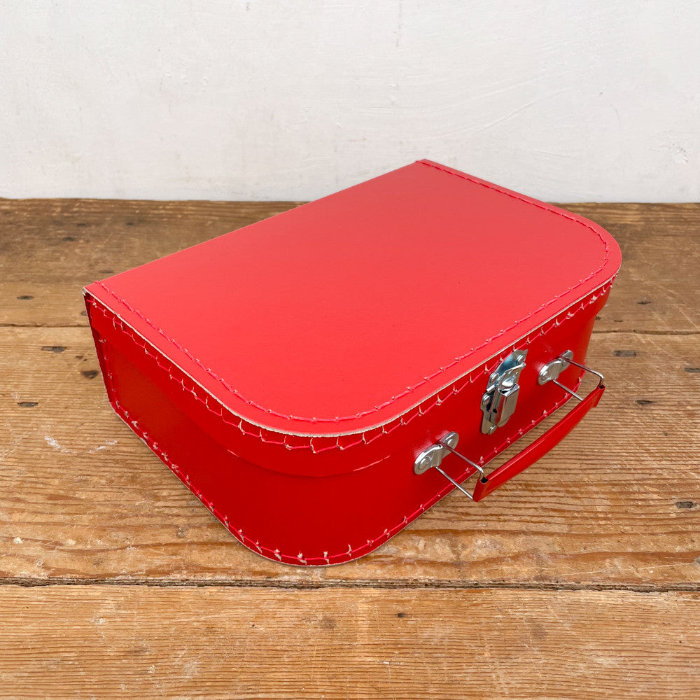 Red cardboard suitcase