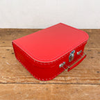 Red cardboard suitcase