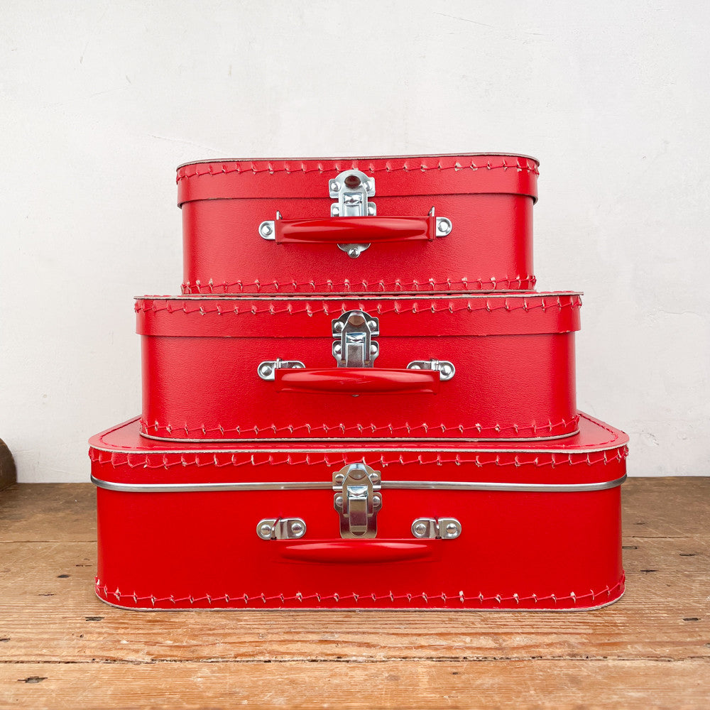 Red cardboard suitcase