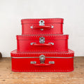 Red cardboard suitcase