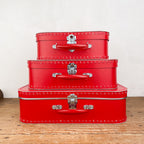 Red cardboard suitcase