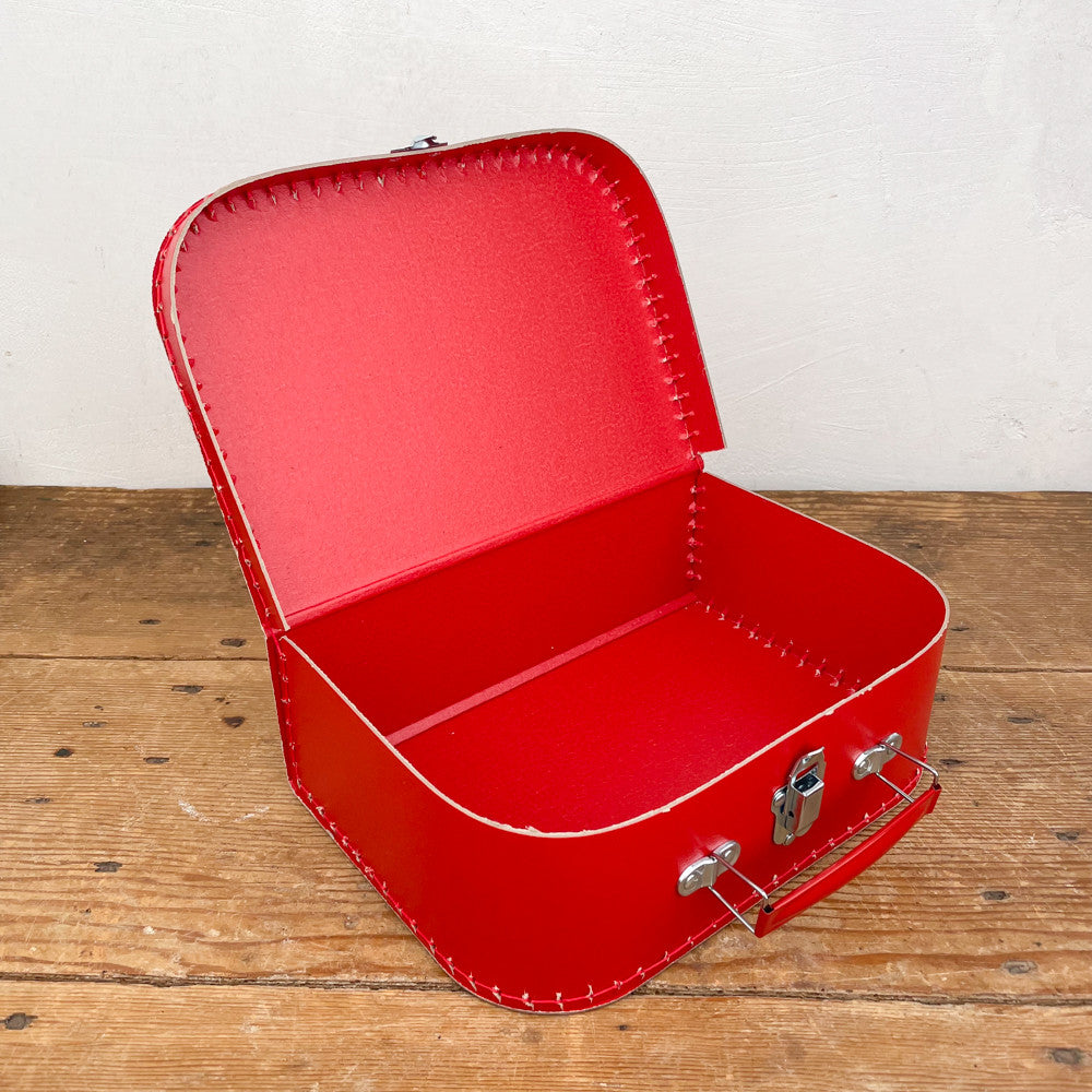 Red cardboard suitcase