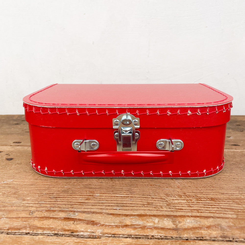 Red cardboard suitcase