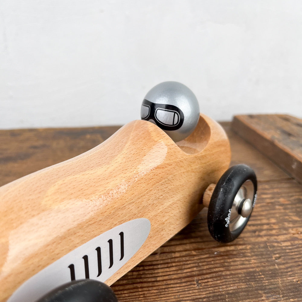 Racing car in natural wood