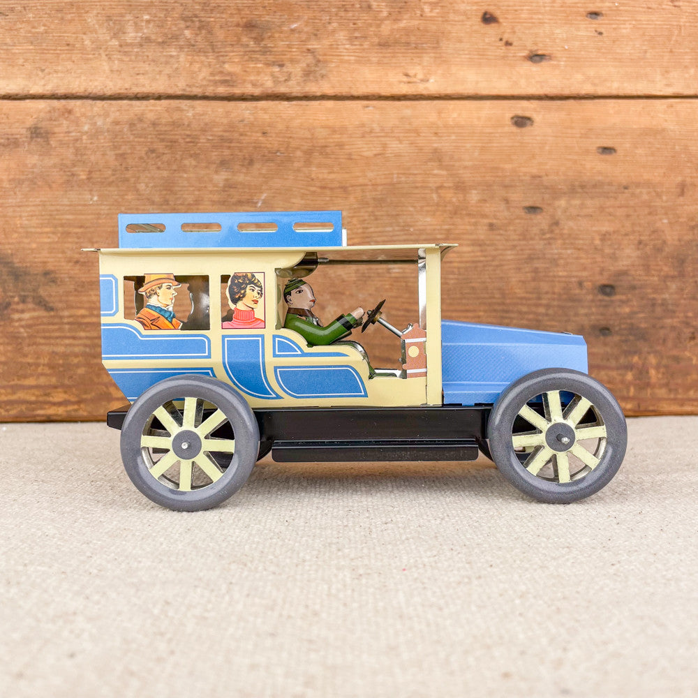 Voiture limousine beige et bleue mécanique
